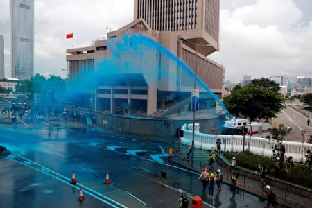 Riot police use water cannon to disperse anti-extradition bill demonstrators during a protest in Hong Kong