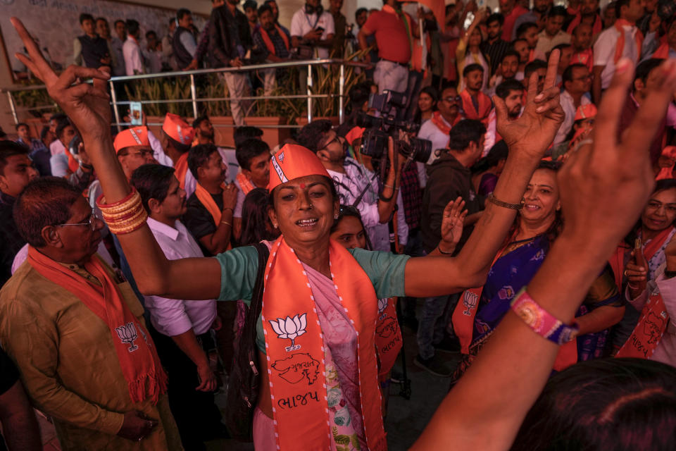 Bharatiya Janata party (BJP) supporters celebrate early leads for the party as vote counting of Gujarat state elections is underway in Gandhinagar, India, Thursday, Dec. 8, 2022. The local elections in Prime Minister Narendra Modi's home state is seen as a barometer of his ruling Bharatiya Janata party’s popularity ahead of a general election in 2024. (AP Photo/Ajit Solanki)