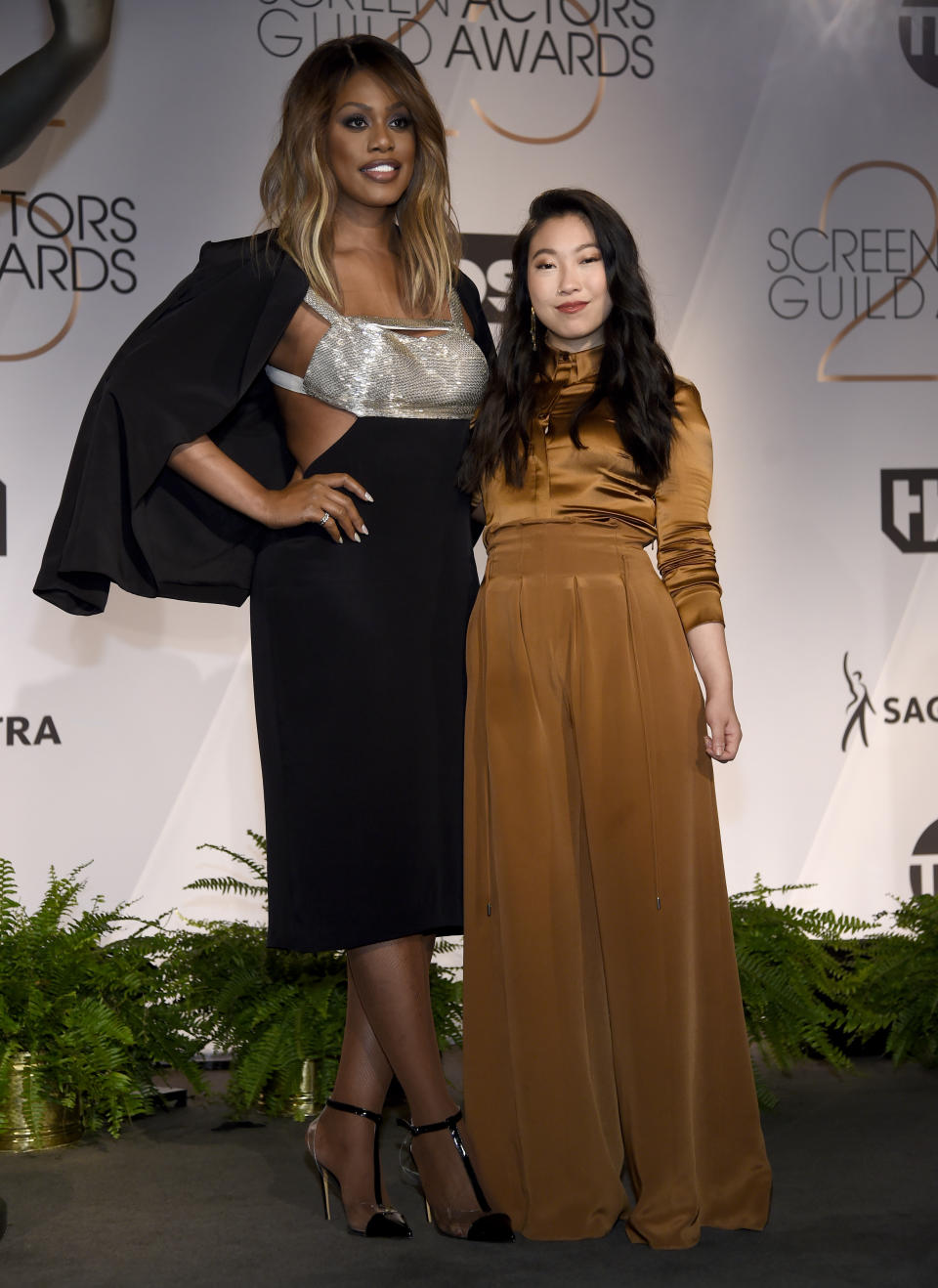 Laverne Cox, left, and Awkwafina pose following the nominations announcement for the 25th annual Screen Actors Guild Awards at the Pacific Design Center on Wednesday, Dec. 12, 2018, in West Hollywood, Calif. The show will be held on Sunday, Jan. 27, 2019, in Los Angeles. (Photo by Chris Pizzello/Invision/AP)