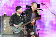 Guy Berryman, left, and Chris Martin of Coldplay performs during the band's Music of the Spheres world tour on Thursday, May 12, 2022, at State Farm Stadium in Glendale, Ariz. (Photo by Rick Scuteri/Invision/AP)