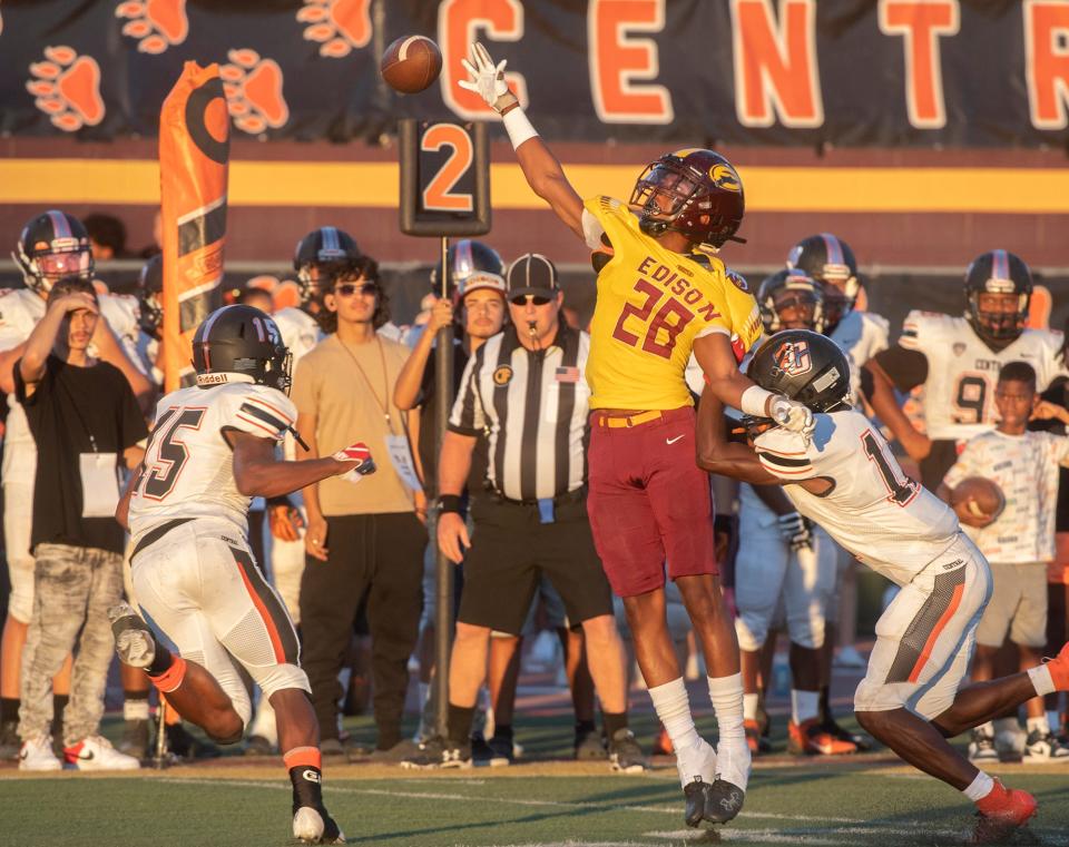 Edison's Robert Conner (28), center, breaks up a pass intended for Central's Imari Conley (15). Edison dropped the home opener 28-7 on Friday, Aug. 19.