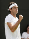 Taylor Fritz of the US celebrates a point against Slovakia's Alex Molcan during their men's third round singles match on day six of the Wimbledon tennis championships in London, Saturday, July 2, 2022. (AP Photo/Alberto Pezzali)