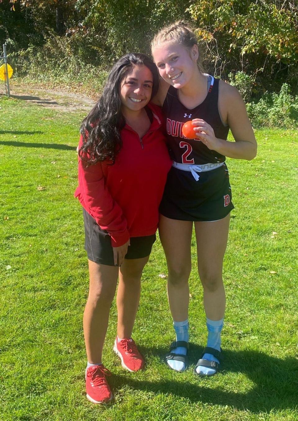 Durfee freshman field hockey player Kathryn Gauvin holds up the game ball with Hilltopper head coach Nicole Henrique last fall after breaking the school record for most goals in a season.