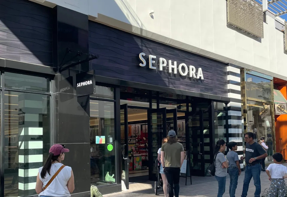 shoppers approaching a sephora store in a mall