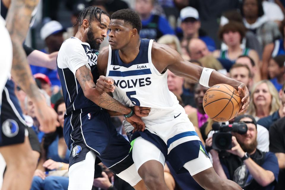 Anthony Edwards dribbles against the Dallas Mavericks' Derrick Jones Jr. during Game 4.