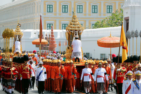 A procession to transfer the relics and royal ashes of Thailand's late King Bhumibol Adulyadej arrives at the Grand Palace after the cremation ceremony in Bangkok, Thailand, October 27, 2017. REUTERS/Jorge Silva