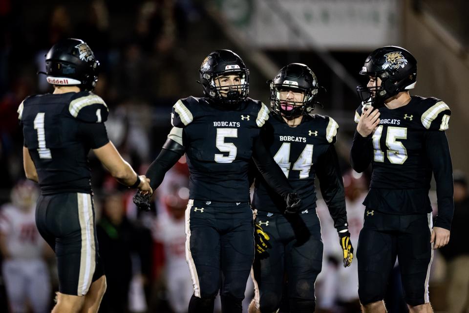 Buchholz Bobcats outside linebacker Colin Nechodom (5) reacts to a personal foul penalty during the first half against the Crestview Bulldogs during the 2022 FHSAA Football State Championships 4S Regional Semifinal at Citizens Field in Gainesville, FL on Friday, November 18, 2022. [Matt Pendleton/Gainesville Sun]