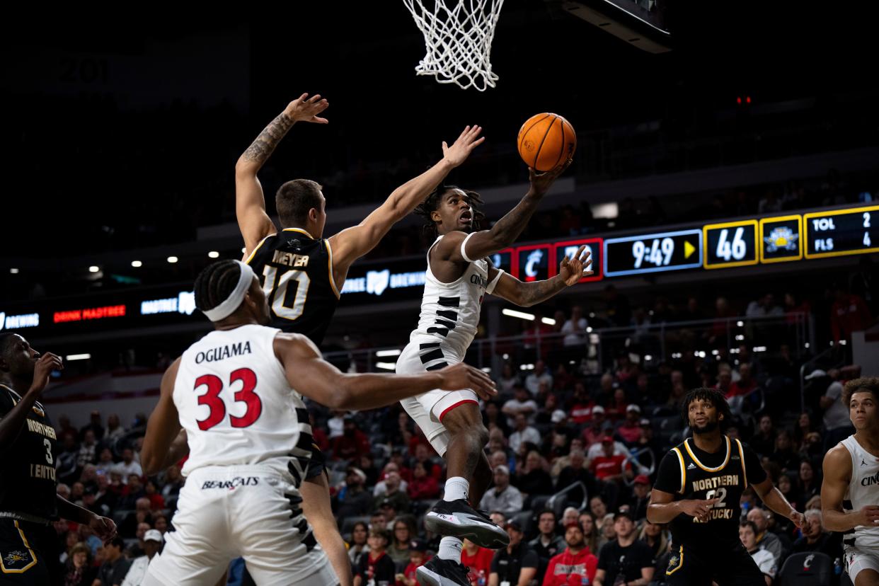 Cincinnati Bearcats guard Jizzle James (2) goes up for a layup  against NKU's Norse Nov. 19. The Bearcats play Howard on Tuesday. His brother Eden is a running back for the Howard Bison football team.