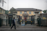 A Chinese paramilitary police officer stands guard outside the British Embassy in Beijing, Friday, March 26, 2021. China has announced sanctions on British individuals and entities following the U.K.'s joining the EU and others in sanctioning Chinese officials accused of human rights abuses in the Xinjiang region. (AP Photo/Mark Schiefelbein)