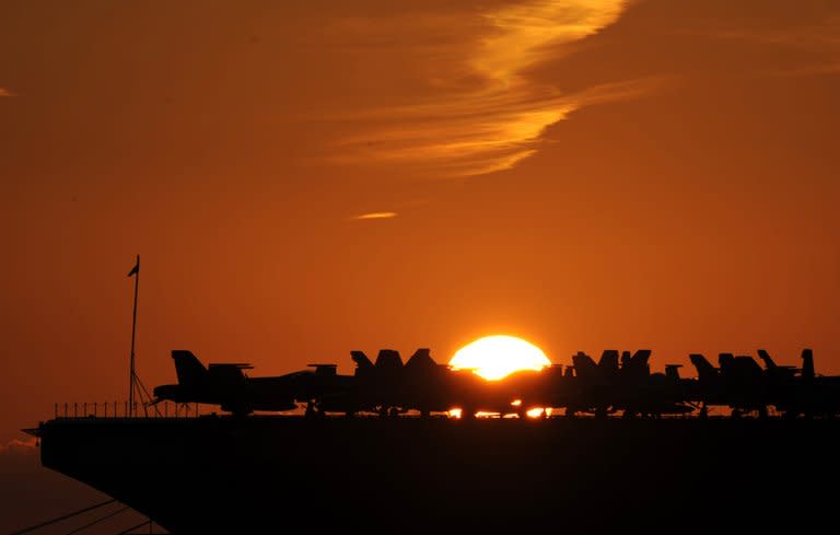 Planes are parked on the deck of the USS George H.W. Bush (CVN77) aircraft carrier in Marseille, France, on November 27, 2011. Budget pressures at the Pentagon have renewed a debate about the value of the US Navy's giant aircraft carriers, with critics arguing the warships are fast becoming costly relics in a new era of warfare