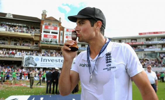 Cook celebrates with the Ashes urn at the Oval in August, 2015 (Getty)