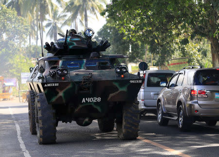 An armoured personnel carrier belonging to government troops drives along a main highway of Pantar town, Lanao Del Norte, as it travels to reinforce Marawi city, southern Philippines May 24, 2017. REUTERS/Romeo Ranoco