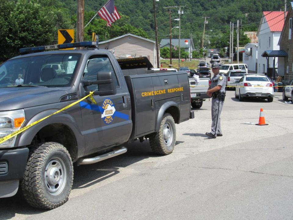 Kentucky State Police blocked off a street in Allen, a small town in Floyd County, Ky., on July 1, 2022 as the investigation continued into a shooting in which two police officers were killed.