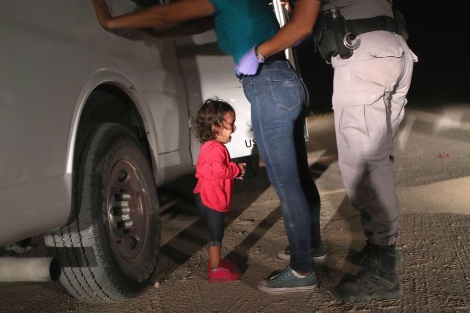 This photo of a two-year-old Honduran asylum seeker crying as her mother is searched and detained near the U.S.-Mexico border inspired Dave and Charlotte Willner to begin a Facebook fundraiser for immigrants
