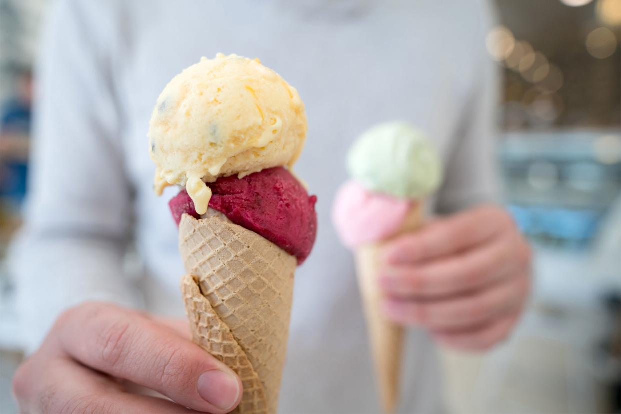 Closeup of man holding ice cream cones