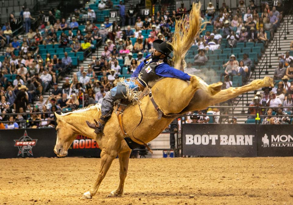 A man rides a horse at the Bill Pickett Invitational Rodeo in Las Vegas