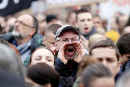 A man shouts slogans during the protest rally in reaction to the murder of Slovak investigative reporter Jan Kuciak and his fiancee Martina Kusnirova, in Bratislava, Slovakia, March 16, 2018. REUTERS/David W. Cerny