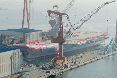 China's first domestically built aircraft carrier is seen during its launching ceremony in Dalian, Liaoning province, China, April 26, 2017. REUTERS/Stringer