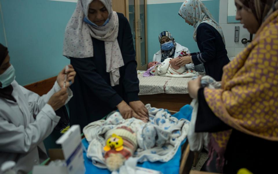 Palestinian children receive pentavalent vaccines in Rafah, Gaza