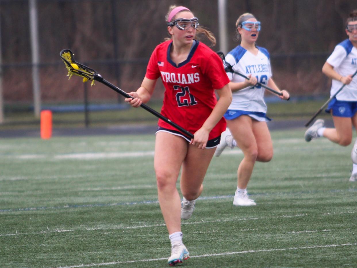 Bridgewater-Raynham's Ashley McLaren cradles the ball upfield during a non-league game against Attleboro.