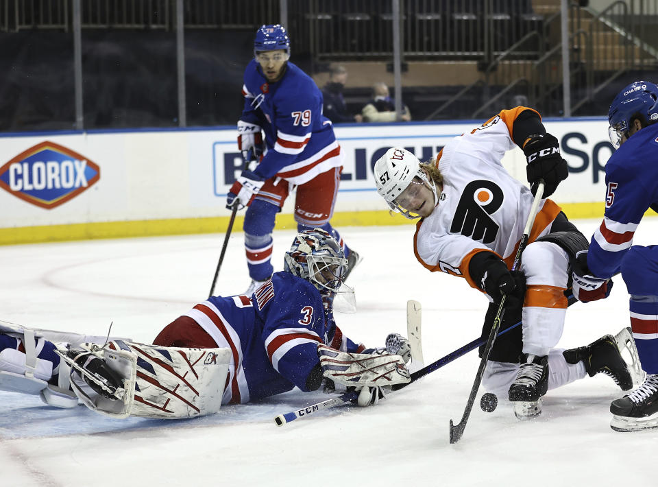 New York Rangers' Igor Shesterkin (31) stops a shot by Philadelphia Flyers' Wade Allison (57) in the first period of an NHL hockey game Thursday, April 22, 2021, in New York. (Elsa/Pool Photo via AP)