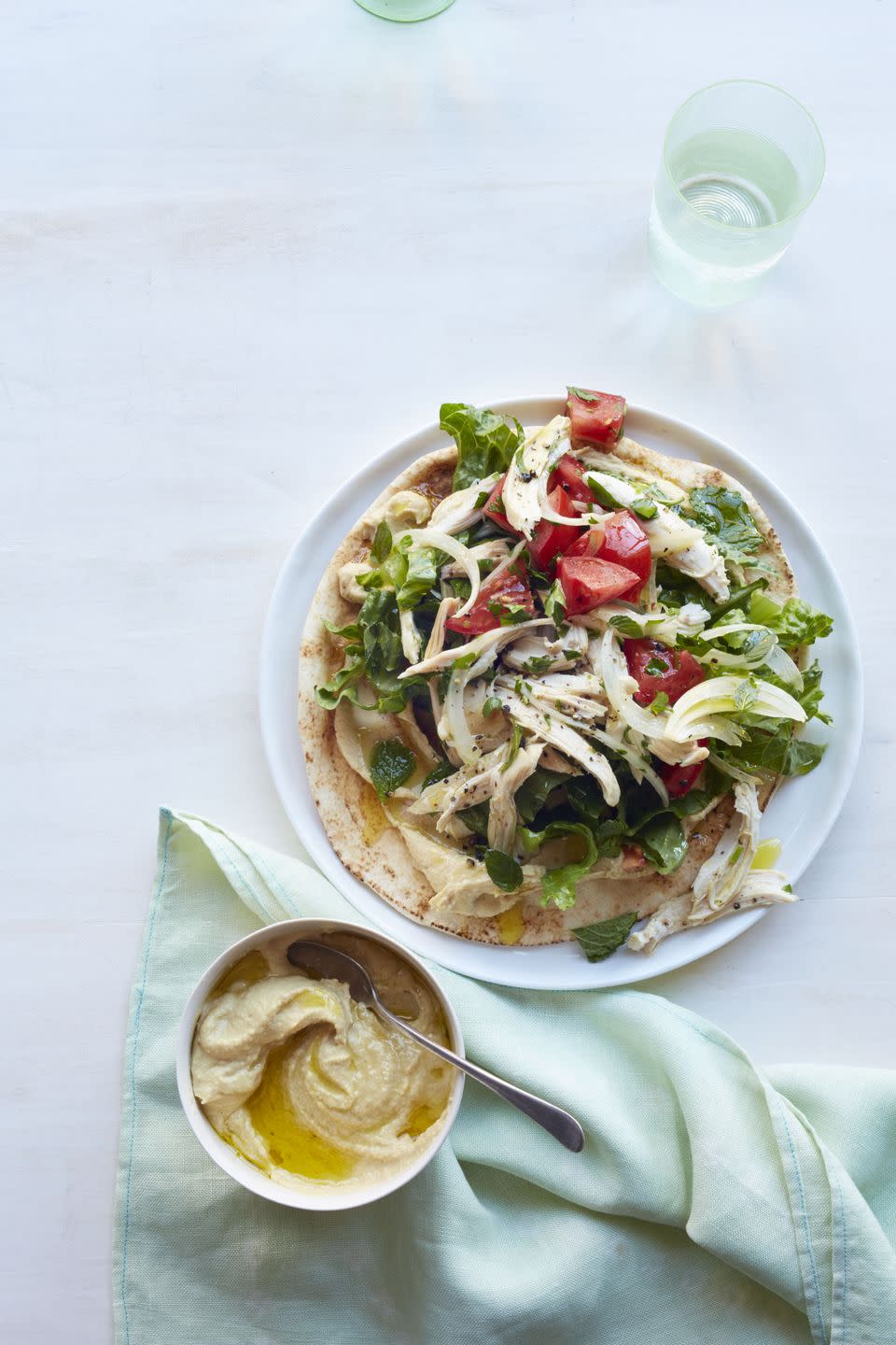 <p>With hummus, olive oil, and plum tomatoes, these quick chicken pitas are easy and healthy.</p><p><a href="https://www.womansday.com/food-recipes/food-drinks/recipes/a13253/mediterranean-chicken-pitas-recipe-wdy0215/" rel="nofollow noopener" target="_blank" data-ylk="slk:Get the Mediterranean Chicken Pitas recipe.;elm:context_link;itc:0" class="link "><em><strong>Get the Mediterranean Chicken Pitas recipe.</strong></em></a></p>
