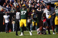 Green Bay Packers nose tackle Kenny Clark (97) celebrates his sack of Chicago Bears quarterback Justin Fields during the second half of an NFL football game Sunday, Oct. 17, 2021, in Chicago. The Packers won 24-14. (AP Photo/David Banks)