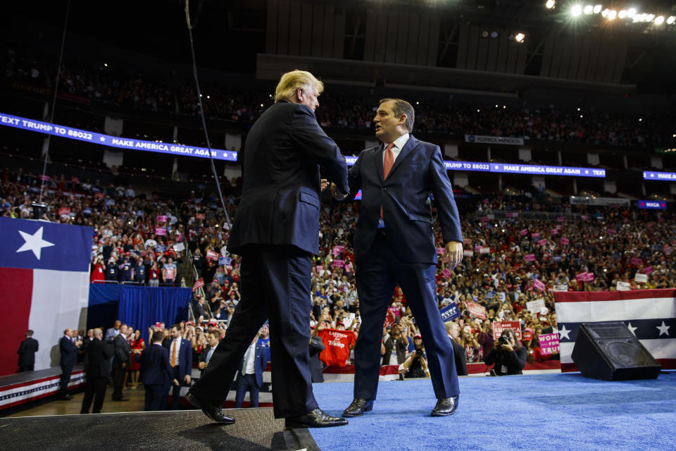 President Donald Trump is greeted by Sen. Ted Cruz, R-Texas, as he arrives for a campaign rally at Houston Toyota Center, Monday, Oct. 22, 2018, in Houston. (AP Photo/Evan Vucci)