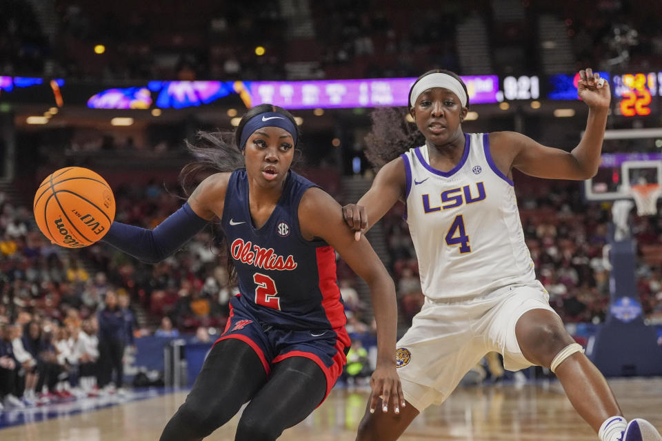 Ole Miss guard Marquesha Davis controls the ball against LSU's Flau'jae Johnson during an SEC game. (Jim Dedmon-USA TODAY Sports)