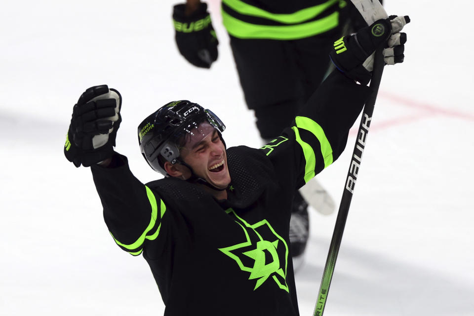 Dallas Stars left wing Mason Marchment (27) reacts after scoring his third goal for a hat trick against the Chicago Blackhawks in the third period of an NHL hockey game Sunday, Dec. 31, 2023, in Dallas. (AP Photo/Richard W. Rodriguez)