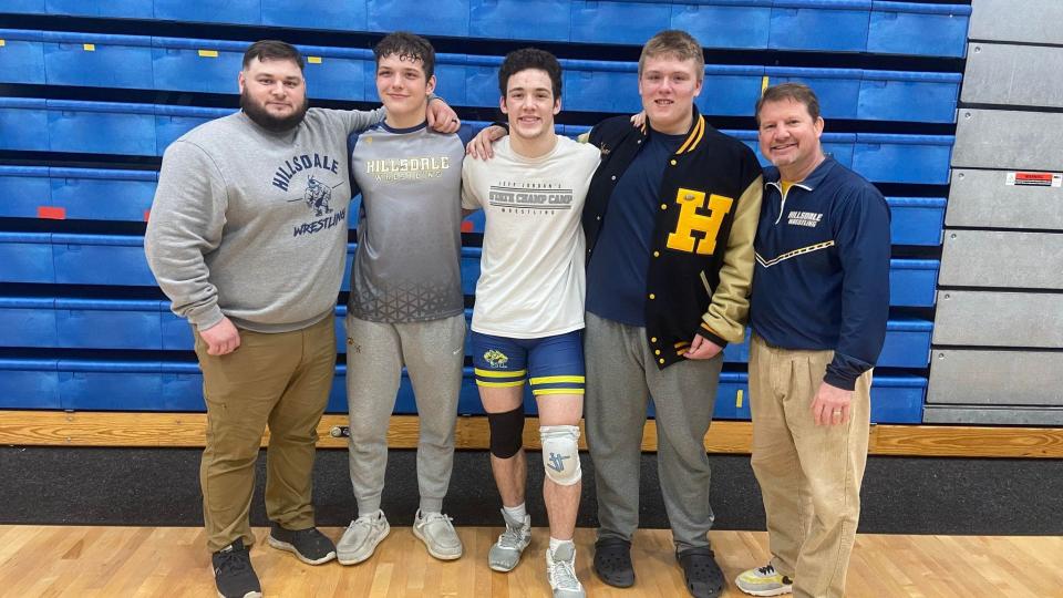 The Hornet wrestling team, led by head coach Nate Spieth (left) sends all three of their regional qualifiers (John and Stephen Petersen and Wyatt Wahtola) to the state finals on March 3rd.