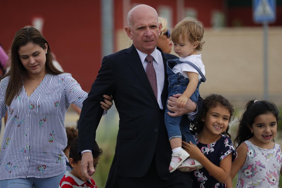 EDS NOTE : SPANISH LAW REQUIRES THAT THE FACES OF MINORS ARE MASKED IN PUBLICATIONS WITHIN SPAIN. Accompanied by family members, former Venezuelan military spy chief, retired Maj. Gen. Hugo Carvajal, center, walks out of prison in Estremera, outskirts of Madrid, Spain, Sunday, Sept. 15, 2019. Spain's National Court on Monday rejected the extradition to the United States of a former Venezuelan military spy chief accused of drug smuggling and other charges. (AP Photo/Manu Fernandez)