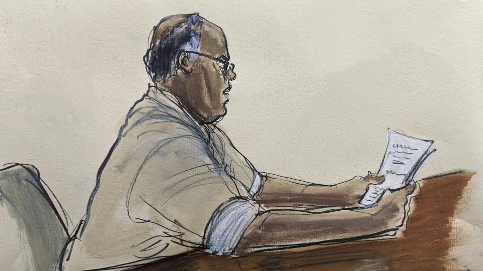 In this courtroom sketch, Frank James, reads a statement of guilt in Brooklyn federal court, Tuesday, Jan. 3, 2023, in New York. James, who opened fire and wounded 10 passengers on a Brooklyn subway train last year has pleaded guilty to federal terrorism charges. Frank James admitted pulling the trigger on the Manhattan-bound train as it moved between stations on April 12. (Elizabeth Williams via AP)