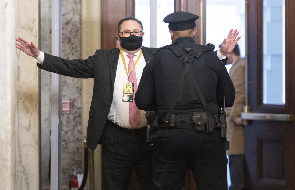 Jason Miller, Senior Adviser to the Trump 2020 re-election campaign, arrives at the Capitol on the fourth day of the second impeachment trial of Trump in the Senate, Friday, Feb. 12, 2021, in Washington. (Bill Clark/Pool via AP)