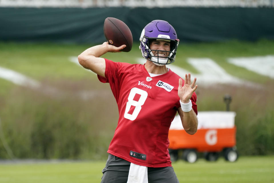 Minnesota Vikings quarterback Kirk Cousins (8) throws during the NFL football team's training camp, Thursday, Aug. 5, 2021, in Eagan, Minn. (AP Photo/Jim Mone)