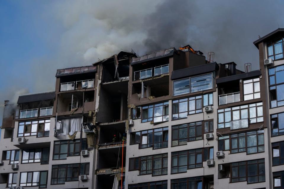 Smoke billows into the air from residential buildings following explosions in Kyiv on Sunday (Nariman El-Mofty/AP) (AP)