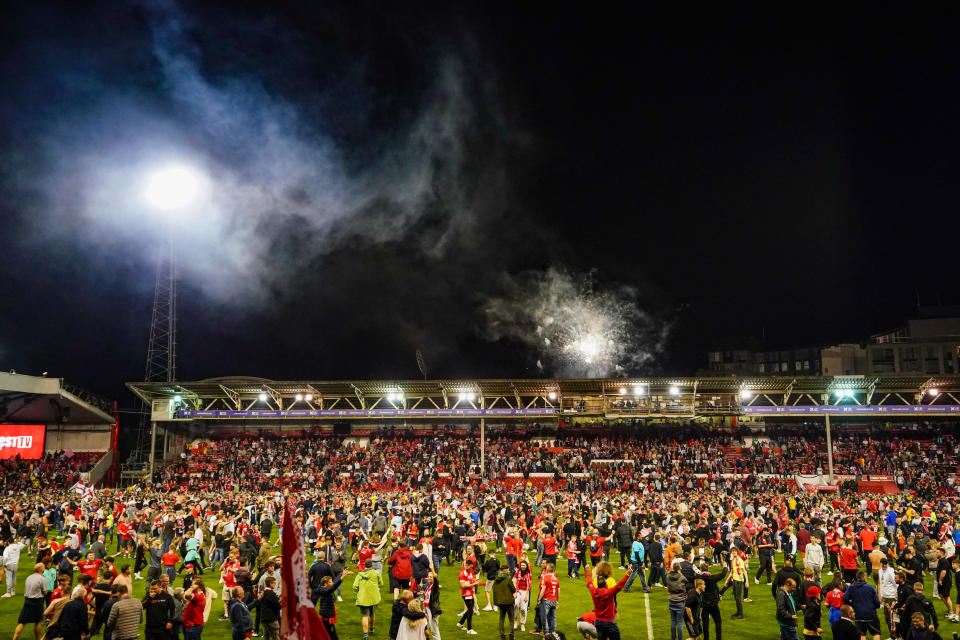 Nottingham Forest fans celebrate on the pitch after they reach the play off final during the Sky Bet Championship play-off semi-final, second leg match at the City Ground, Nottingham. Picture date: Tuesday May 17, 2022.