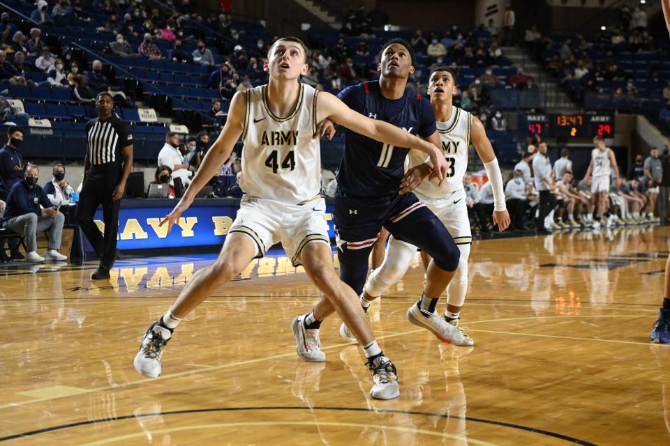 Army's Matt Dove battles Navy's Jaylen Walker for a rebound during Saturday's game in Annapolis, Maryland. Army prevailed 74-73 in overtime. NAVY ATHLETICS