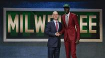 <p>Thon Maker, right, poses for a photo with NBA Commissioner Adam Silver after being selected 10th overall by the Milwaukee Bucks during the NBA basketball draft, Thursday, June 23, 2016, in New York. (AP Photo/Frank Franklin II) </p>