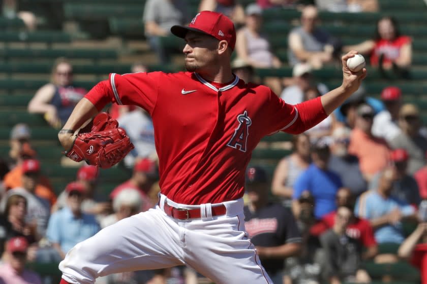 Los Angeles Angels pitcher Andrew Heaney throws during the first inning of a spring training baseball game against the Cleveland Indians Monday, March 9, 2020, in Tempe, Ariz. (AP Photo/Matt York)