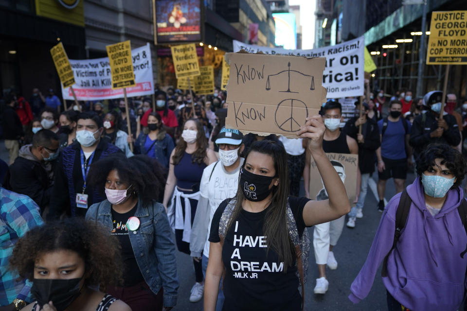 A group of protesters walk through the streets after the verdict in the trial of Derek Chauvin was announced in New York, Tuesday, April 20, 2021. Former Minneapolis police Officer Derek Chauvin has been convicted of murder and manslaughter in the death of George Floyd, the explosive case that triggered worldwide protests, violence and a furious reexamination of racism and policing in the U.S. (AP Photo/Seth Wenig)