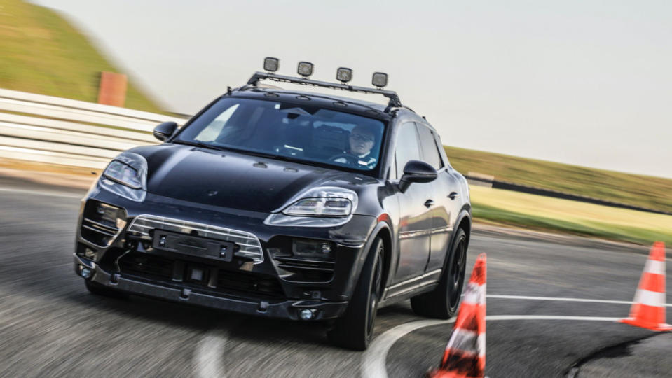 A prototype of the all-electric Porsche Macan undergoing track testing in 2021. - Credit: Photo: Courtesy of Porsche AG.
