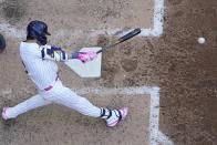 Milwaukee Brewers' Christian Yelich hits a single during the fifth inning of a baseball game against the St. Louis Cardinals Sunday, May 12, 2024, in Milwaukee. (AP Photo/Morry Gash)