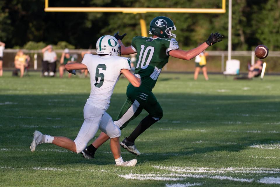 Pennfield's Brenden Duncan (10) just misses a pass as Olivet's Brody Lehman (6) puts on pressure during first half action on Thursday, September 1, 2022.