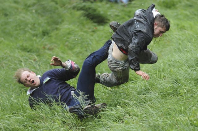 New champion savours as hurtles glory cheese rolling race