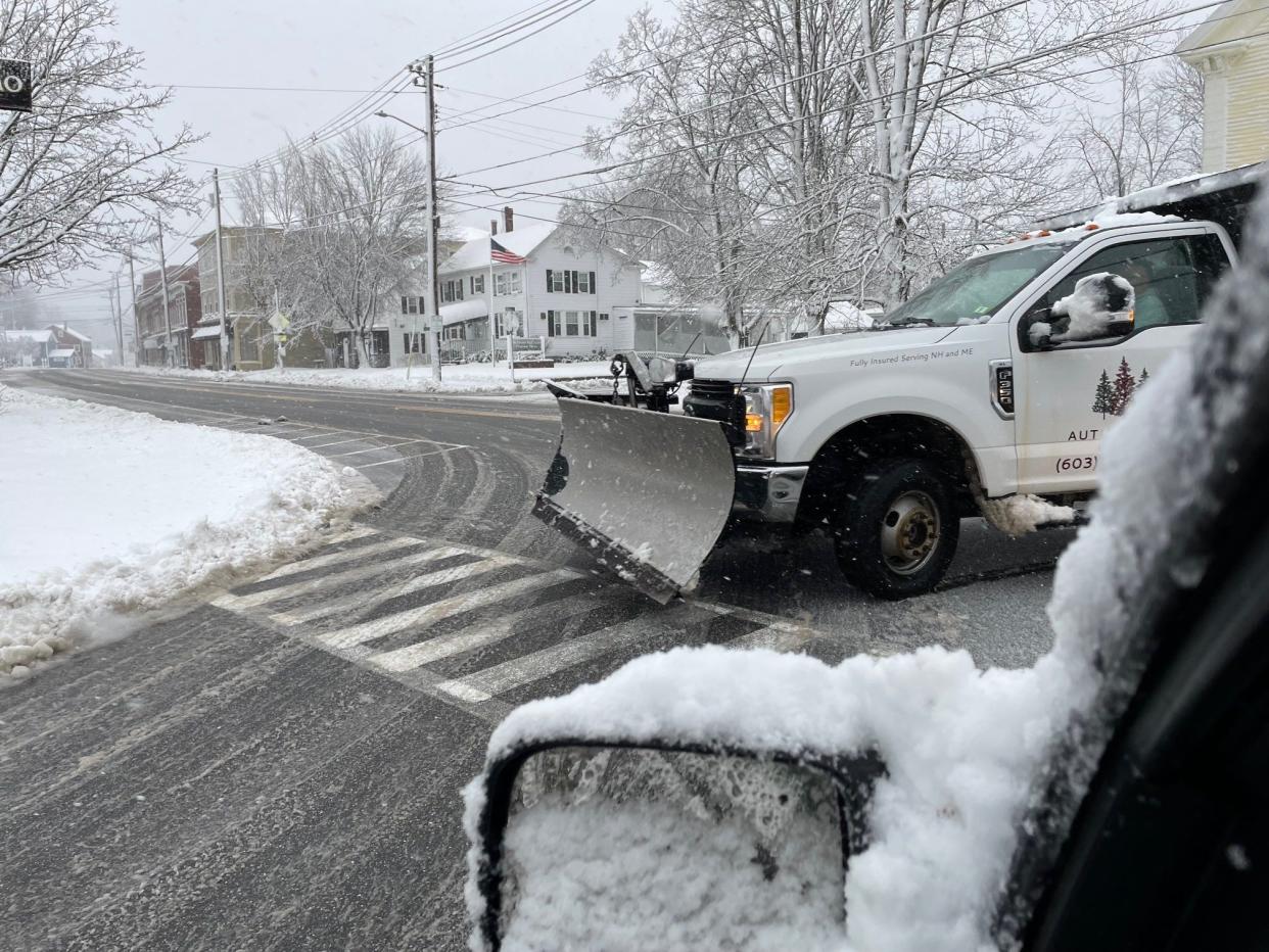 A plow turns onto Norton Street in South Berwick, Maine, early Thursday, April 4, 2024 as a spring storm hits the region.