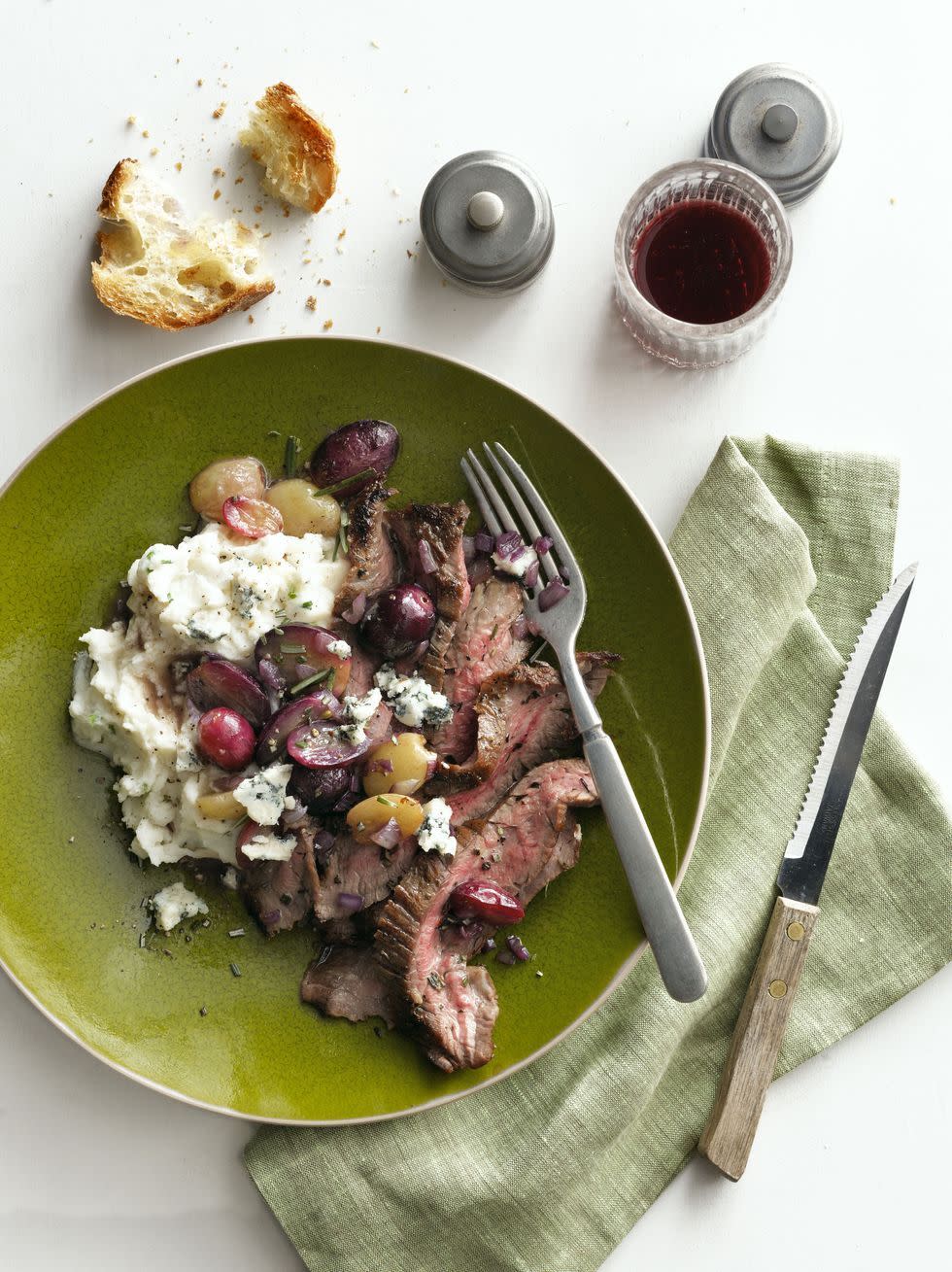 herbgarlic crusted flank steak with panroasted grapes
