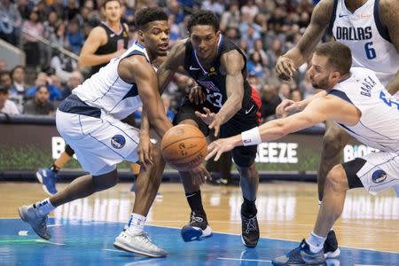 Dec 2, 2018; Dallas, TX, USA; LA Clippers guard Lou Williams (23) and Dallas Mavericks guard Dennis Smith Jr. (1) and guard J.J. Barea (5) fight for the loose ball during the second half at the American Airlines Center. Mandatory Credit: Jerome Miron-USA TODAY Sports