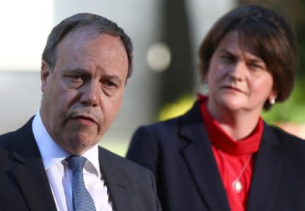 FILE PHOTO: DUP Leader Arlene Foster and DUP Deputy Leader Nigel Dodds speak to television crews outside 10 Downing Street in London, Britain, July 2, 2018. REUTERS/Simon Dawson