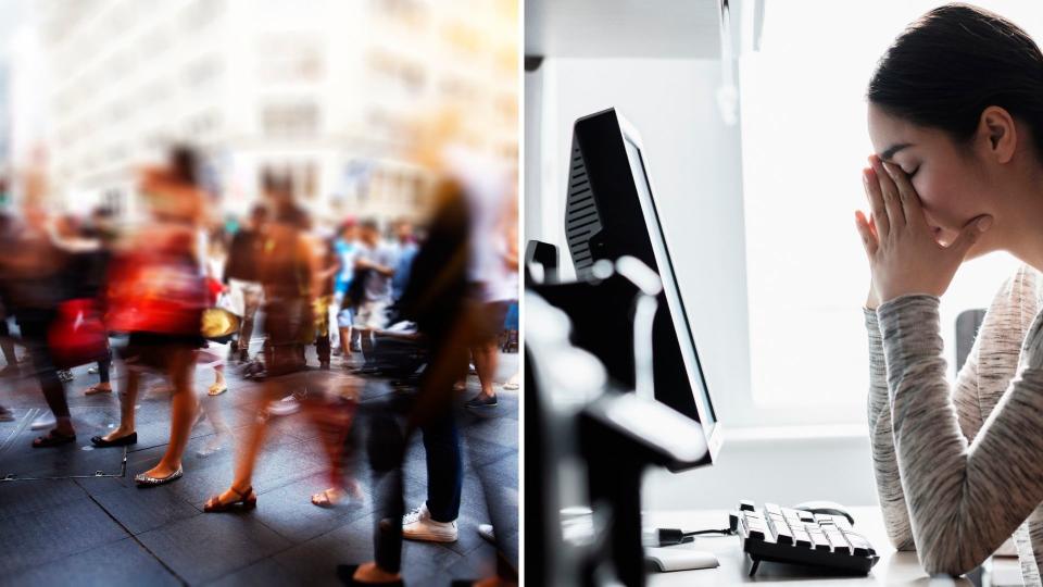 Blurred image of pedestrians in Australia, woman at computer desk with head in her hands, stressed. 